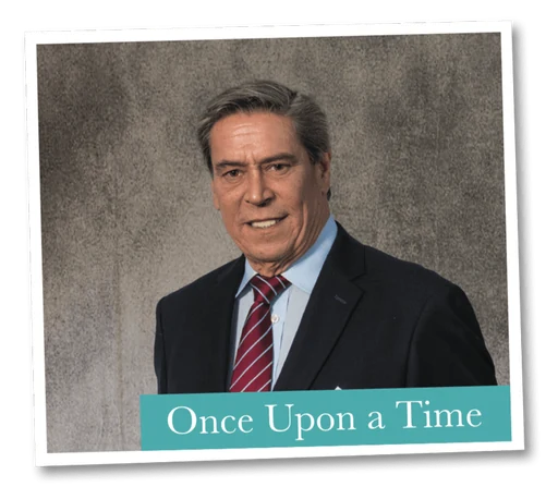 Oliver C. Brown in a studio portrait, dark suit and striped tie, captioned “Once Upon a Time”